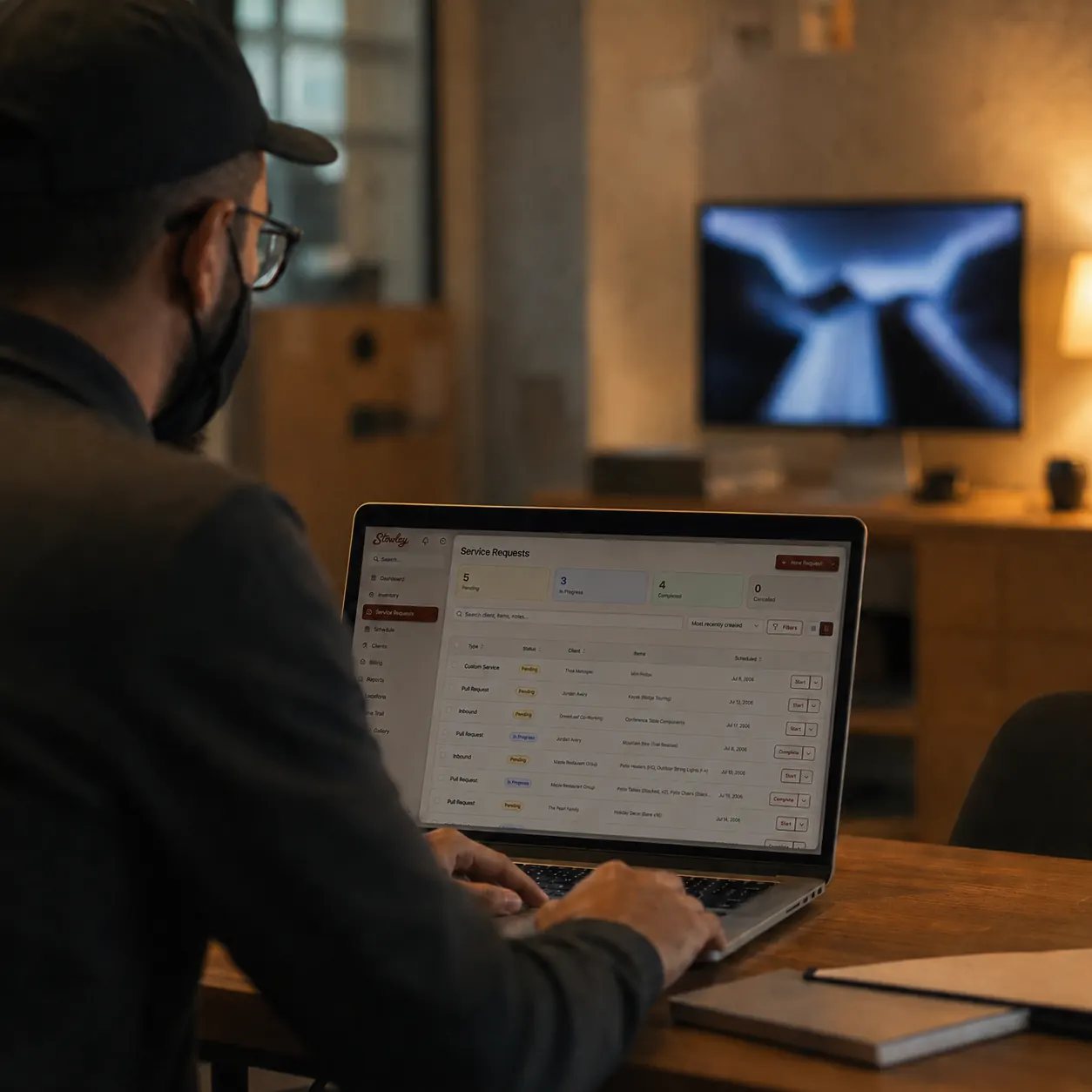 Moving company dispatcher reviewing a CRM dashboard on a laptop